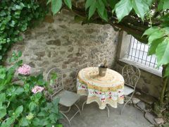 Relax under the wysteria with a glass of champagne